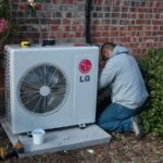 A technician is servicing an LG air conditioner, focused on maintenance and repair tasks.