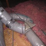 Insulated duct featuring pink material, illustrating a practical approach to HVAC system insulation.