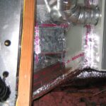 A metal duct covered in insulation, illustrating a common method for improving energy efficiency