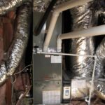 Interior view of a room featuring a furnace and ductwork