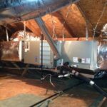 lennox furnace connected to multiple ducts throughout an attic