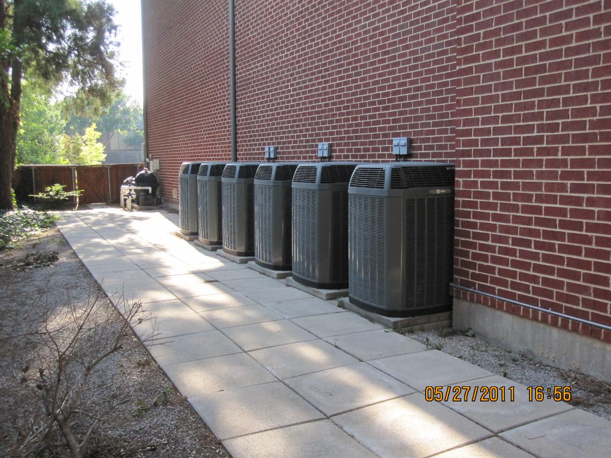 6 outdoor HVAC units at a residential building