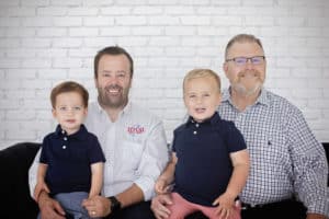 Family photo of Steve Lauten, his son Justin, and Justin's two young sons.