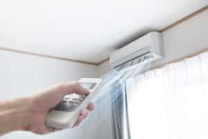 Ductless air conditioner being turned on by remote