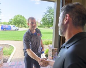 Total Air Heat & Plumbing Technician Arriving at Customers Door