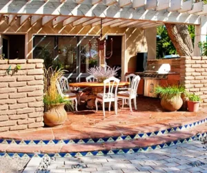 Outdoor patio in Plano, TX with built-in grill, dining area, and pergola designed for heating and cooling comfort How Do Regional Allergens Like Pollen Impact Indoor Air?